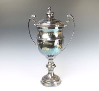 A silver plated 2 handled presentation trophy and lid 52cm