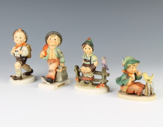 Four Hummel figures - Wayside Harmony 10cm, Singing Lesson 8cm, Merry Wanderer 10cm and boy with backpack 11cm 