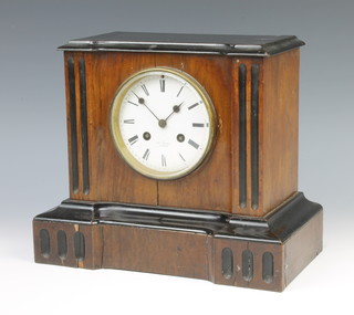 Hay Marc of Paris, a 19th Century French 8 day striking mantel clock with enamelled dial and Roman  numerals contained in an ebonised and walnut case 