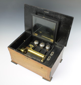 A Victorian Swiss musical box playing 8 airs contained in an inlaid walnut case 
