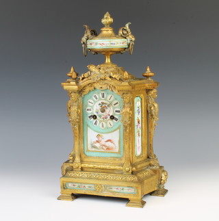 Japy Frere, a 19th Century French 8 day mantel clock with floral painted porcelain panels contained in a gilt metal painted case surmounted by a lidded urn, the reverse of the case is marked 4 P.H. Mourey 73 16841GF, the movement signed Japy Frere 