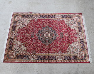 A red ground Kashan style Belgian cotton carpet with central medallion 230cm x 160cm 
