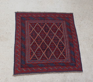 A blue and red ground Gazak rug with diamond field within multi-row borders 123cm x 112cm 