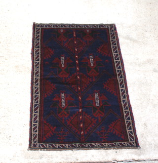 A red and blue ground Baluchi rug 130cm x 88cm 