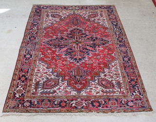 A red and cream ground Persian Heriz carpet 294 x 219cm 