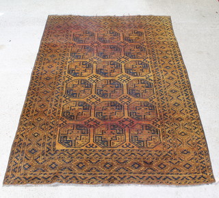 A golden ground Afghan carpet with 18 octagons within a multi-row border 279 x 204cm  