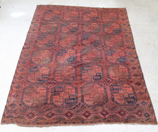 A red and blue ground Afghan carpet with 24 octagons with a multi-row border 336 x 251cm 