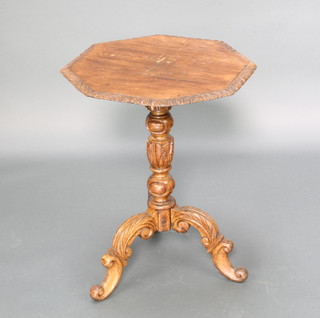 A Victorian octagonal carved oak wine table raised on carved pillar and tripod base 58cm x 45cm x 45cm  
