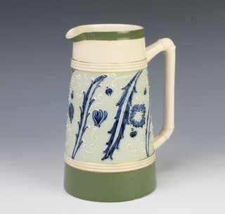 A Gesso Faience jug decorated with flowers 18cm 