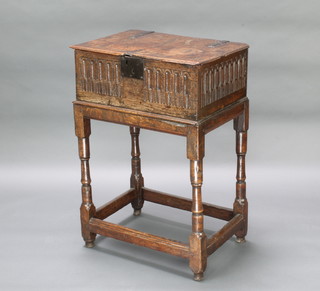 A 17th Century carved oak bible box and stand with hinged lid and arcaded decoration, raised on turned and block supports 88cm h x 61cm w x 43cm d