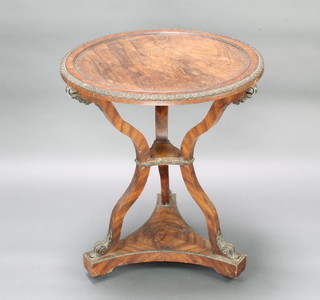 A Regency circular rosewood occasional table with gilt metal mounts, raised on shaped supports and triform base 74cm h x 64cm d