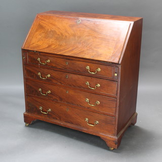 A Georgian mahogany bureau the fall front revealing a well fitted interior above 4 long drawers with brass swan neck drop handles raised on bracket feet 103cm h x 92cm w x 52cm d 