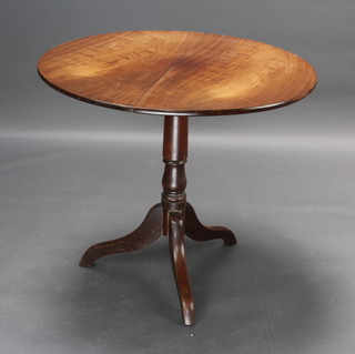 A 19th Century circular snap top tea table raised on turned column and tripod supports 70cm h x 80cm diam. 