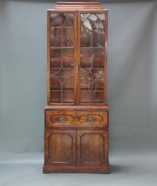 A 19th Century mahogany secretaire bookcase with associated moulded cornice,  fitted adjustable shelves enclosed by astragal glazed panelled doors, the base fitted a secretaire drawer above a double cupboard fitted 3 trays 260cm h x 98cm w x 54cm d 