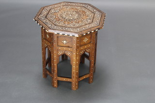 An Indian octagonal inlaid hardwood folding table, the underside bears old label Kanhya Lal Brij Lal Hoshiarpur 41cm h x 41cm w x 41cm d 