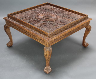 A square Burmese carved hardwood coffee table, raised on cabriole supports 46cm h x 78cm w x 77cm d 