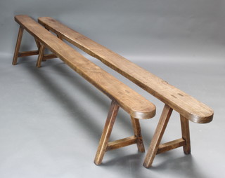 A pair of 18th/19th Century elm trestle benches 46cm x 15cm w x 250cm l 

