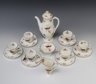 A Royal Doulton coffee set decorated with spring flowers and birds H1422 comprising coffee pot and lid, cream jug, 6 coffee cups, saucers and a sugar bowl 