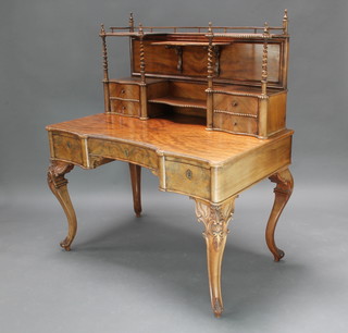 A Victorian Continental bleached mahogany dressing/writing table, raised super structure of serpentine outline fitted shelves and a recess flanked by 4 long drawers, the base fitted 1 long drawer flanked by 2 short drawers raised on carved cabriole supports 135cm h x 115cm w x 67cm d, the bottom left hand glove drawer with pencil inscription J Moller Hamburg 1853