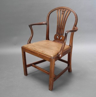 A Georgian mahogany Hepplewhite style carver chair with upholstered drop in seat raised on square tapered supports with H framed undertier
