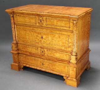 A Victorian Continental satin birch commode with reeded columns to the side fitted 4 long drawers raised on a platform base 93cm h x 108cm w x 59cm d 