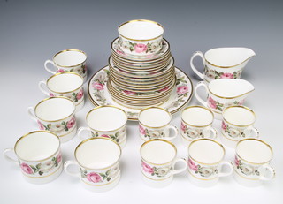 A Royal Crown Derby Royal Garden tea and coffee set comprising 6 coffee cans, 6 tea cups, 6 small saucers, 6 large saucers, a sugar bowl, cream jug, milk jug and 2 sandwich plates