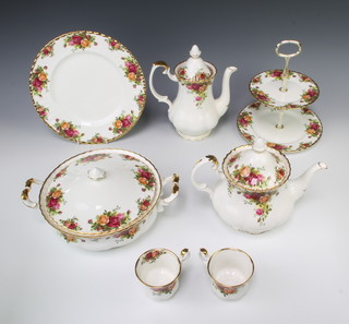A Royal Albert Old Country Roses tea, coffee and dinner service comprising 6 coffee cups and saucers, 6 tea cups and saucers, teapot, coffee pot, boxed spoons, cake slice, cake knife, fork and jam spoon, 12 small plates, 8 medium plates, 8 dinner plates, 8 soup bowls, sauce boat, 2 sauce boat stands, 2 sugar bowls, a cream jug, milk jug, 2 tureens and covers, an oval meat plate, 2 tier cake stand and a sandwich plate 