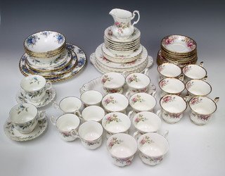 Three part tea services - Royal Albert Moss Rose comprising 4 coffee cups, 4 tea cups, 6 saucers, 4 small plates, 8 medium plates, sandwich plate, cream jug and sandwich plate, Royal Albert Autumn Roses with 6 tea cups and saucers, 6 small plates and a Royal Albert Brigadoon tea set with 2 tea cups and saucers and a Royal AlbertMoonlight rose tea set with 4 dessert bowls, 2 small plates, 2 medium plates, 2 large plates and 2 dinner plates 