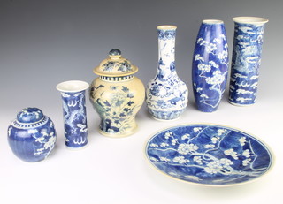 A Chinese prunus plate 27cm, 3 prunus vases, a prunus ginger jar and cover, a blue and white baluster vase and cover and a bottle vase 
