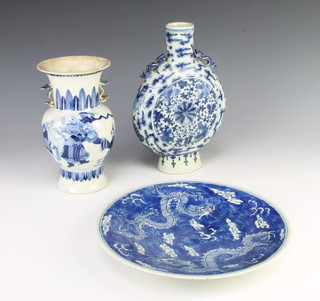A Chinese blue and white moon flask with lion handles and floral decoration 26cm, a blue and white plate and a do. baluster vase 