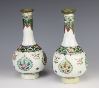 A pair of late 19th Century Chinese famille vert oviform vases decorated with stylised flowers 19cm 