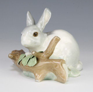 A Lladro rabbit by a log 4773 8cm