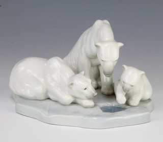 A Lladro group of a family of polar bears by a hole in the ice 1443 16cm