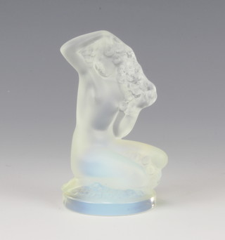 Lalique, an opalescent glass paperweight in the form of a kneeling naked lady etched  R Lalique France 8cm 
