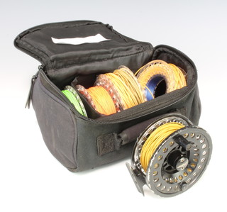 An Air Flo black switch no.7/8 fly fishing reel with 4 spools plus line in maker's pouch 
