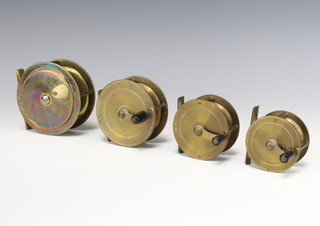 Four vintage brass fishing reels - a 3" crank wind, a 2 1/4", a 2 1/2" and a 3" and a 3 1/2" plate wind reel with horn handle 