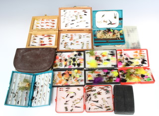 A quantity of fishing fly boxes and wallets with contents of flies 