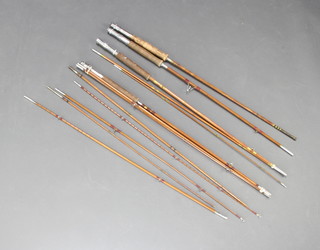 Four split cane fishing rods contained in a cardboard tube 
