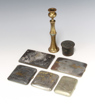 A Japanese niello cigarette case the interior signed and marked K24 12cm x 8cm (some corrosion) together with 4 other Japanese cigarette cases, a turned brass candlestick 18cm and a cylindrical inkwell 4cm x 5cm 