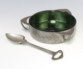Archibald Knox for Liberty a 3 handled pewter butter dish with green glass liner, the base marked English Pewter by Liberty & Co 0162 2 together with an associated spoon 4.5cm h x 12cm diam. 