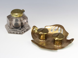 A Victorian hexagonal glass inkwell with metal lid together with an Art Nouveau 2 bottle inkwell the base marked Ges Gesch with 2 associated ceramic inkwells to the interior 