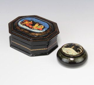 A Russian black lacquered cylindrical jar and cover 1cm x 2cm and a lozenge shaped trinket box with hinged lid 4cm x 4cm x 3.5cm  