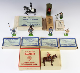 A Britains figure no. 2065 HM Queen Elizabeth Colonel in Chief Grenadier Guards mounted on Burmese (arm f), boxed, a Britains sentry box no.329 complete with sentry (rifle f) and top flap of box missing, do. no. 1639 Range Finder, a Timpo figure Knight in armour boxed and 4 other Timpo historical figures 
 