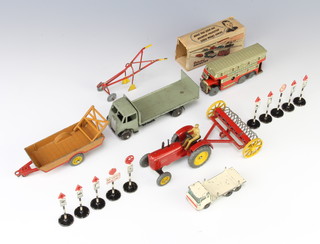 A Brimtoy pocket toy omnibus complete with key and original packing (flaps to box damaged), a Dinky Super-guy flat bed lorry, a Dinky Massey Harris tractor, do. Halesowen Farm trailer, do. hay rake, plough?, 10 Dinky road signs, a Matchbox Series no.58 Girder Truck 