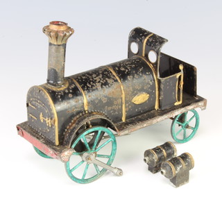 A tin plate model of a self propelled steam locomotive, body marked GR 