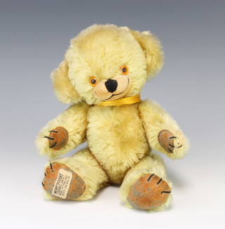 A yellow Merrythought teddybear with articulated limbs 29cm 
