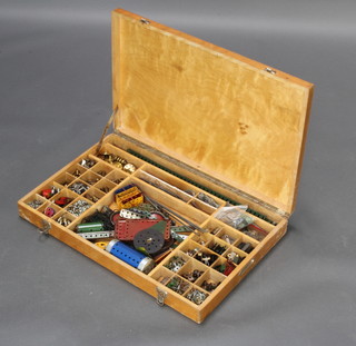 A quantity of green and blue Meccano including various nuts, washers etc contained in a rectangular plywood case 