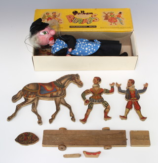 A Victorian wooden double sided figure of a horse with articulated legs together with 2 wooden figures of standing minstrels and a Pelham puppet boxed