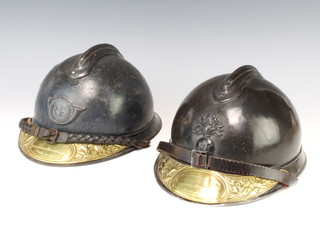 Two French Adrian patent helmets both with brass plaques marked Soldat De La Grande Guerre 1914-1918 