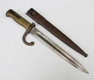 A short French bayonet with 25cm blade, both blade and scabbard marked C4099 